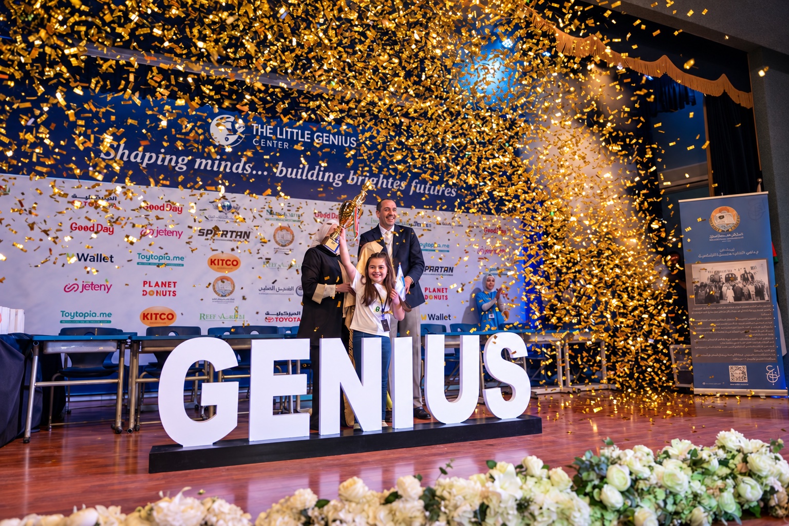 Students and winners on stage at a Little Genius competition