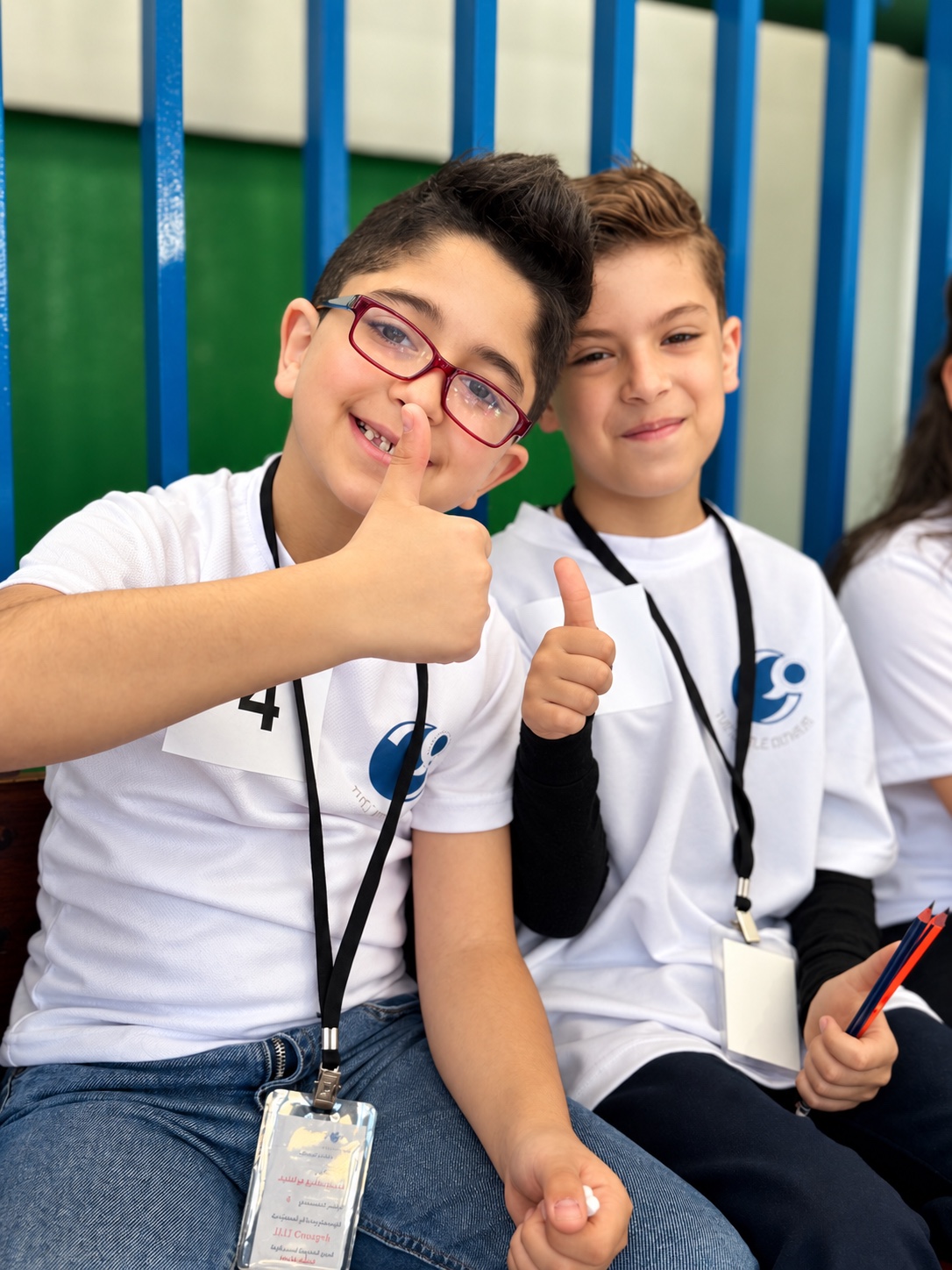 Two Little Genius students sharing a proud moment
